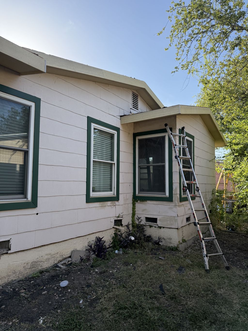 Exterior fascia and soffit repair underway on an older San Antonio home
