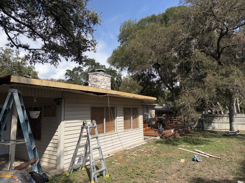 Patio cover roof structure being rebuilt with new framing on a San Antonio home